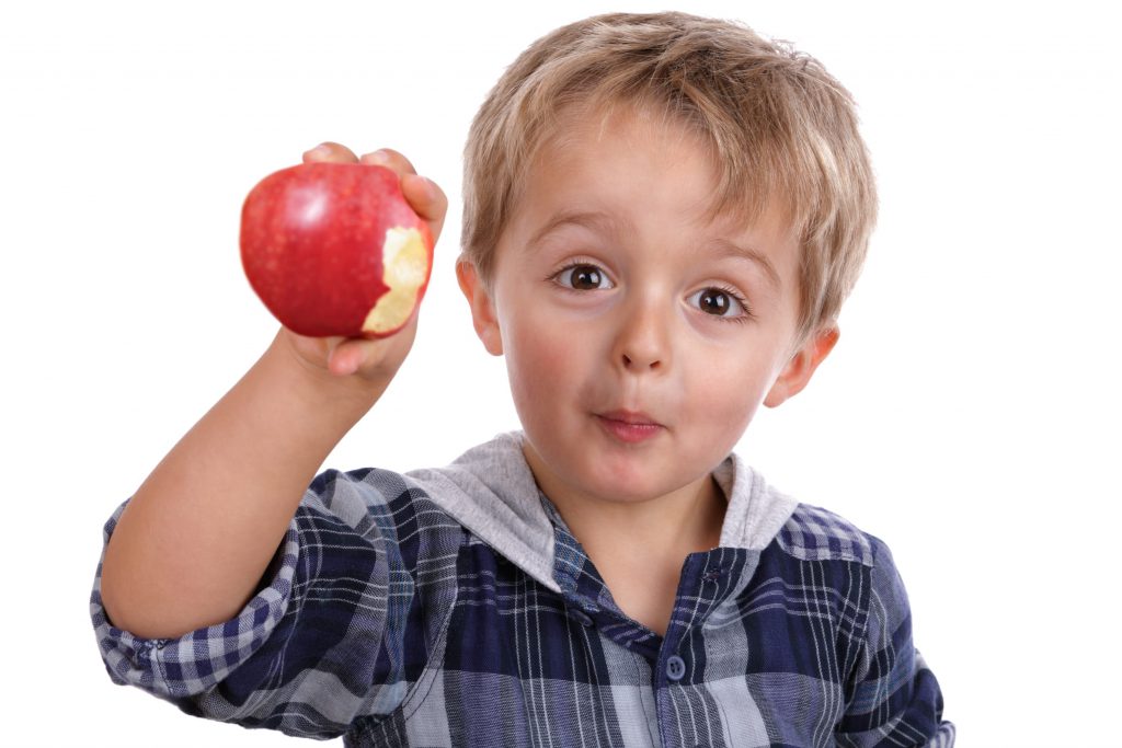 Boy eating an apple